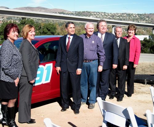 Officials with ceremonial car