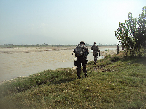 Members of the Missouri ADT survey the Kabul River with USDA’s Tom Vermeersch. 