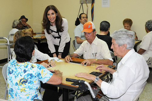 Deputy Administrator for SNAP Lisa Pino talks with senior citizens as they play Cuban dominos at the Little Havana Activities and Nutrition Center in Miami.   (USDA photo by Debbie Haston-Hilger).