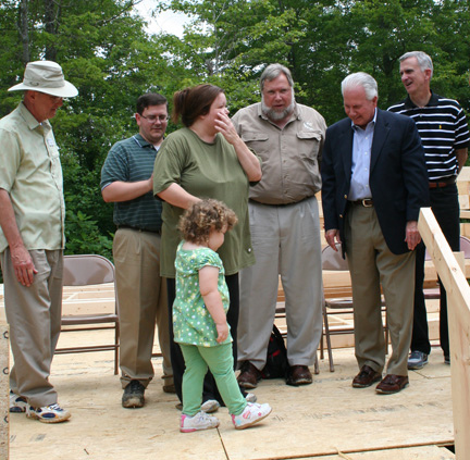 Kentucky State Director Tom Fern (second from right) congratulates new homeowner Kristi Wilson, who was selected=