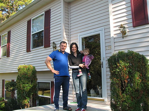 Mihai, Mihaiela, and Sabina Giurca in front of their new USDA-financed home in Egg Harbor Township, New Jersey