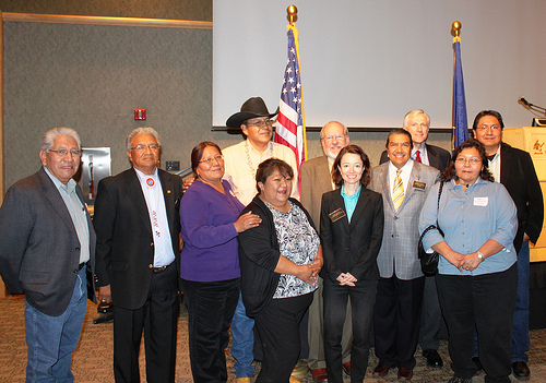 Tribal Consultation:  Front row, left to right, Phillip Chimburas, Ute Indian Tribe; Ernest House, Chairman, Ute Mountain; Leona Eyetoo, South Ute Tribe; Jeanine Borchardt, Chairwoman, Paiute Tribe; Jessica Zufolo, Deputy Administrator, Rural Utilities Service; Forrest S. Cuch, Director, Division of Indian Affairs:  Madeline Greymountain, Tribal Council Member, Confederate Tribes of Goshute Reservations. Back row: Kenneth Maryboy, Navajo, UTL Chair; Dave Conine, Utah State Director, USDA Rural Development; Utah LT. Governor Greg Bell; Leonard Gorman , Executive Director Navajo Nation Human Rights Commission.