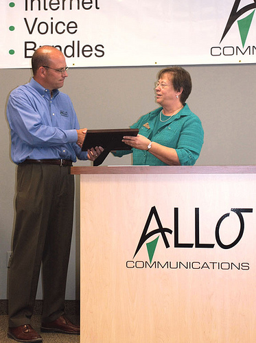 State Director Maxine Moul presents plaque to the President of Allo, Brad Moline for the Recovery Act funds Allo Communications secured to improve telecommunications services in part of Nebraska.