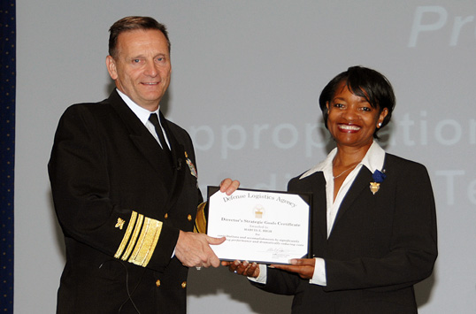 Photo: Admiral presenting award