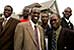 Welcome: Portraits of America, group of men in front of house