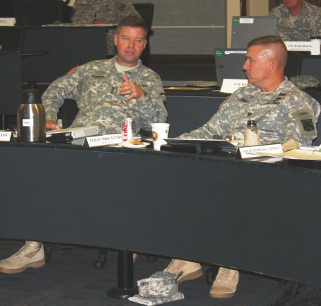 Lt. Gen. David Perkins, commanding general of the Combined Arms Center, talks about the Army training strategy at the Combat Training Center Commanders Conference at Fort Leavenworth, Kan. Col. (P) Mike Lundy, deputy commander of the Combined Arms Center for Training, is at the right.