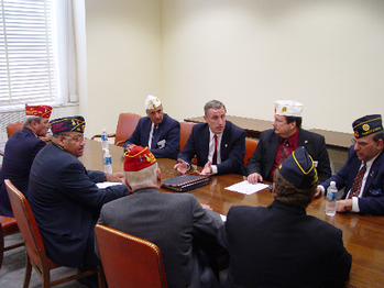Rep. Murphy takes time out after the 2003 Veteran's Committee hearing with the American Legion to learn about the Legions legislative priorities for the coming year. 