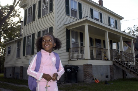 Dorean  from Belhaven stayed in her family's elevated home (behind) which suffered no damage during Hurricane Isabel.