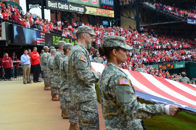 Soldiers from Fort Leonard Wood, Mo., unfurl a flag during Game 3 of the National League Championship Series, Oct. 17, 2012, at Busch Stadium in St. Louis.