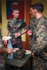 Marines and French Marine paratrooper Lance Cpl. Marvin Lelarge eat lunch together on the first day of Exercise Croix de Sud at Camp la Broche, New Caledonia, Oct. 13. U.S. and French Marines came together for a social prior to beginning bilateral training during Croix du Sud. The Marines are with 1st platoon, Company G. Lelarge is with 8th Marine Infantry Paratrooper Regiment, based out of Castres, France.