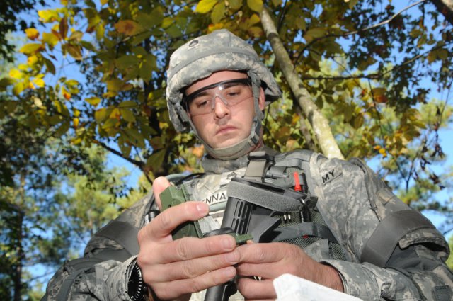 Staff Sgt. Matthew Senna, representing U.S. Army Europe, checks his compass before heading out on the land navigation course, Oct. 16, 2012, during the Best Warrior Competition. The 24 Best Warrior contestants were required to locate five points within a three-hour time limit.