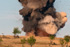 A pile of French munitions blows smoke, dirt and rock high above the treetops at one of the ranges on Camp Bondsteel, Oct. 10.