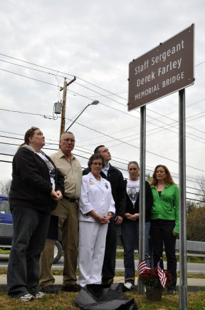 The Farley family after the unveiling of the Staff Sergeant Derek Farley Memorial Bridge sign.  From left: Theresa, sister; Ken, father; Carrie, mother; Dylan, brother; Colleen, sister; and Julie, sister. Farley was explosive ordnance disposal technician who was killed in Afghanistan.