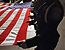 Members of the Customs and Border Protection Honor Guard stand ready with a ceremonial flag in Washington D.C. at a memorial service honoring fallen officers and agents.