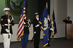 4 members prepare to post the Colors during a retirement ceremony