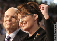 Palin with fist raised in victory (AP Images)