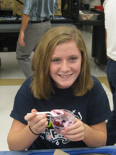 A Jackson Middle School student enjoys a healthy yogurt parfait with fresh fruit at lunch time.