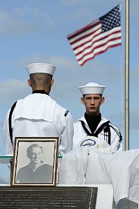 Information System Technician Seaman French Travis forms up during the burial service of Pearl Harbor survivor Boatswain's Mate 1st Class Jack Gordon Franklin.