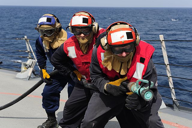 ARABIAN SEA (Oct. 17, 2012) Damage Controlman 3rd Class Tyler O'Donnell, front, Damage Controlman 1st Class Justin Christensen and Seaman Sidarius Martin advance on a simulated fire during a crash and salvage drill aboard the guided-missile destroyer USS Farragut (DDG 99).   Join the conversation on social media using #warfighting. 
