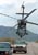 A CBP Air unit UH-60 Blackhawk helicopter intimidates two vehicles on a remote air strip in America's southwest border region.