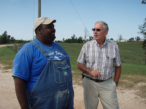 Cattle and poultry farmer Anthony Lovett and Supervisory District Conservationist Ron Read monitor the success of conservation practices, such as the incinerator and cross-fencing, on his Jasper County farm.