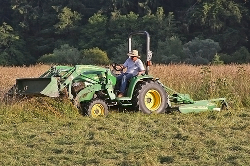 A volunteer from the Oregon Hunter’s Association mows a meadow on the Hebo Ranger District. (USFS Photo)