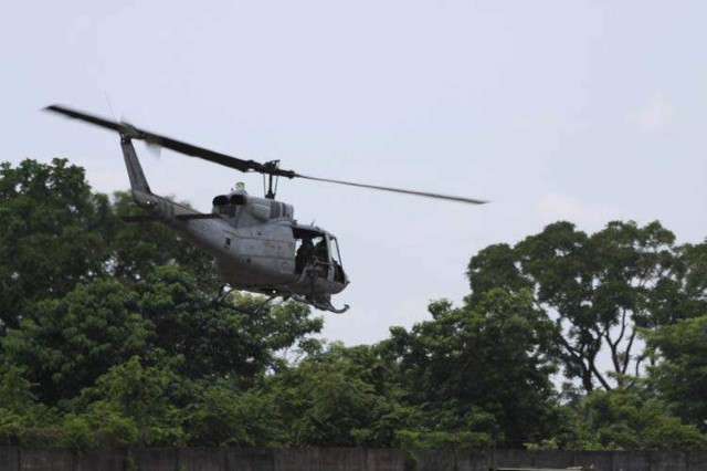 RETALHULEU, Guatemala - A UH-1N Huey helicopter aircrew takes off from the flight line at Santa Elena, Petén 'Base Aérea del Sur', (Air Force Base South).