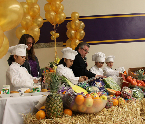 Salida Union School District’s Child Nutrition Services Director, Chef Billy Reid (right), Tammy Zeiger (left), a member of his team, and several students demonstrate how to cook a healthy school lunch using USDA Foods.