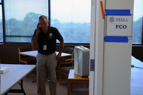 Federal Coordinating Officer Bill Vogel takes a phone call inside of a half completed joint field office.