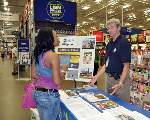 James Zemlicka, Hazard Mitigation specialist, answers questions for a Lowe's customer on rebuilding safely.