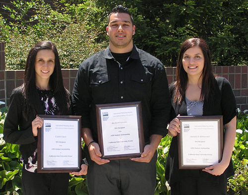 Fresno State University students Caitlin Guest (far left), Aki Dionisopoulos (center), and Amanda Jo Bettencourt (right) receive plaques from AMS.   These students were the 2011 recipients of the AMS Assistantship.  All three currently work with AMS.