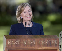Close-up of Hillary Rodham Clinton at podium, smiling (AP Images)