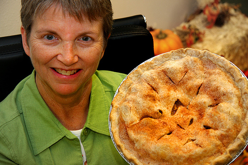 Last Chance Café manager Peggy Tobin shows off a homemade apple pie baked by a volunteer co-op member. 