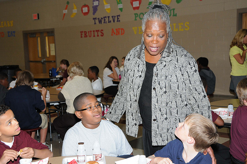 FNS Deputy Administrator for Special Nutrition Programs Audrey Rowe talks with Byram Middle School students during their lunch period following a ceremony in which their school received a HealthierUS School Challenge Gold Award on Oct 14.