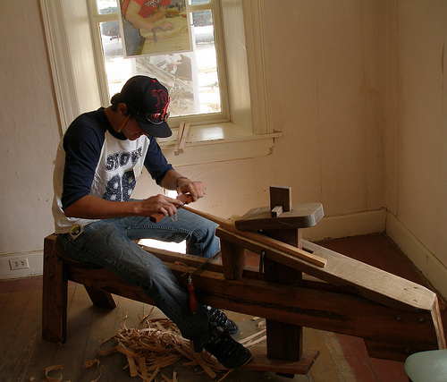 Traditional Building Skill in Action: Gage Olson uses traditional woodworking tools. 