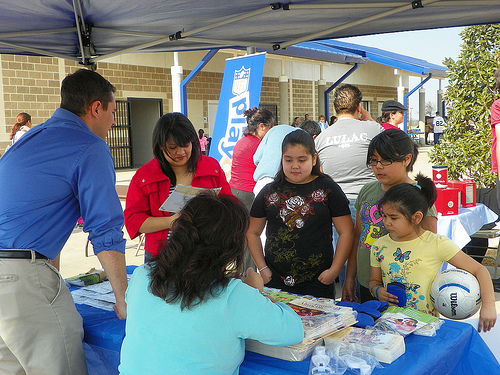 USDA FNS employees promoted HealthierUS information to Latino families at the NFL/LULAC Feria de Salud on Jan. 30.