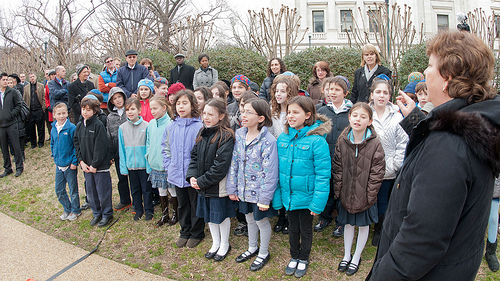 3rd Grade Class of the Jewish Primary Day School of the Nation’s Capitol sing “the Almond Tree is Blossoming” to the attendees, during the Celebration of Tu B’Shevat “The New Year of the Trees” event, at the District of Columbia western lawn next to the USDA Headquarters, Whitten Building at 14th Street and Independence Ave SW, Washington, D.C. on Wednesday, February 8, 2012. USDA Photo by Lance Cheung.