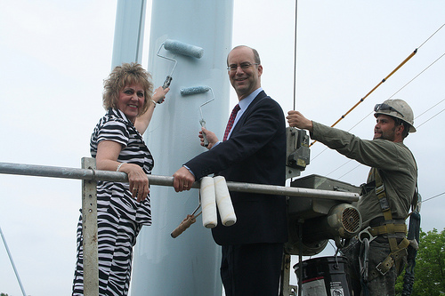 Anita J. (Janie) Dunning, Missouri State Director, and Jonathan Adelstein, RUS Administrator (center), painting the Ralls County PWSD No. 1 water tower