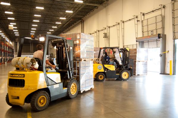 Atlanta, Ga., Aug. 24, 2012 -- These forklift operators are loading meals onto a truck at the Atlanta Distribution Center to be shipped closer to areas that may be impacted by Tropical Storm Isaac. FEMA moves commodities and equipment before the storm arrives to ensure quick delivery after the storm has passed.