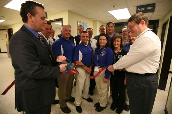 Anniston, Ala., Feb. 1, 2012 -- FEMA Chief of Staff Jason McNamara (Left) and Center for Domestic Preparedness Superintendent Dr. Christopher T. Jones cut the ribbon opening the renovated emergency department inside the Noble Training Facility (NTF).