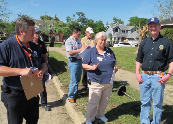 Texas, April 6, 2012 --Preliminary Damage Assessment teams fanned out across the Dallas Fort Worth area in the aftermath of the Tuesday tornadoes. Dallas County Judge Clay Jenkins, (r) is Joined JOhn Nelson, of FEMA (L) and Ruby Dailey (c) of Texas Department of Emergency Management.