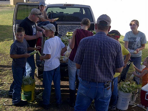 Loyal Doers 4-H Club members get produce ready for their community farmers market.  The market was started by the club as a response to the needs of the community, and helps teach members the fundamentals of agriculture and community involvement.  Photo by Bradley D. James