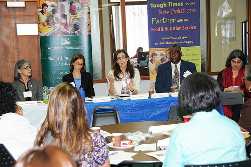 FNS Deputy Administrator for SNAP Lisa Pino (center),  USDA Center for Faith-Based and Neighborhood Partnerships Acting Deputy Director Julie Curti (left), and SERO Regional Administrator Donald Arnette (right), meet with local government leaders, hunger advocates, faith-based groups and community partners, June 3, during a roundtable in Miami. 