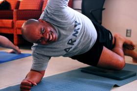 Staff Sgt. Thomas Edmunds participates in a yoga class to help soldiers who suffer from traumatic brain injuries at Eisenhower Army Medical Center at Fort Gordon on Wednesday.  EMILY ROSE BENNETT/STAFF