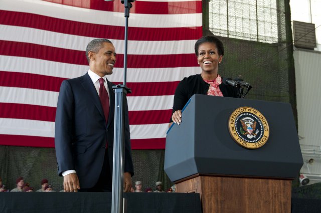 First Lady Michelle Obama introduces President Barack Obama to service members and their families after delivering a powerful speech about how they both admire service members and their families at Pope Army Airfield on Fort Bragg, N.C., Dec. 14, 2011.