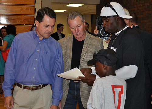 RA Ludwig, Texas Department of Agriculture Todd Staples, Deion Sanders and Former NFL Athlete/Hall of Famer review activities that are planned for the children at Sanders’ youth camp.