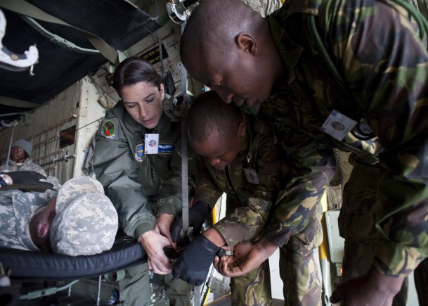 Air National Guard Staff Sgt. Sara Baker of the 156th Aeromedical Evacuation Squadron out of Charolette, N.C., assists members of the Botswana Defence Force during a mass casualty exercise at Southern Accord 2012, at the Thebephatshwa Air Base in Botswana, Africa, Aug. 14, 2012. Southern Accord 2012 is a combined, joint exercise, which brings together the Botswana Defence Force with U.S. Forces to strengthen their partnership through humanitarian assistance, peacekeeping operations and aeromedical evacuation.