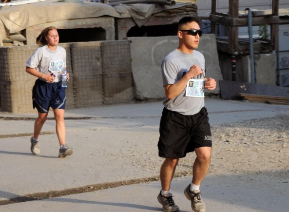 U.S. Army Spc. James Yi, a legal clerk working for NATO Training Mission-Afghanistan, who originally deployed from the 13th Expeditionary Sustainment Command from Fort Hood, Texas, participates in the Army Ten-Miler shadow run at Camp Eggers, Kabul, Afghanistan, Oct. 7, 2012. The run started at 6 a.m. to ensure low traffic on the run routes. Eggers is such a small place that runners had to do 16 laps on the designated track to cover ten miles.