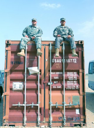 Staff Sgt. Tyler Isenhour (on right), from Concord, N.C., and Spc. Jeffrey Brewer, both North Carolina National Guard Soldiers from the 1452nd Transportation Company, served on Mobile Container Assessment Teams in Afghanistan. Their hard work resulted in the identification of 82 commercial containers that were previously unaccounted for and worth more than $1,245,000 in government property and detention fees.