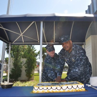 Photo: Commander U.S. Naval Forces Southern Command/U.S. Fourth Fleet, Rear Admiral Sinclair Harris and Information systems Technician Thomas Ford cut the cake during the celebration of the Navy's 237th birthday at the 4th Fleet Headquarters.  Admiral Harris and Seamen Ford are the senior and junior sailors respectively